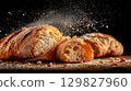 Freshly baked ciabatta on a dark background 129827960