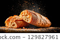 Freshly baked ciabatta bread on dark surface 129827961