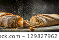 Freshly baked ciabatta on a dark background 129827962