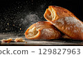 Freshly baked ciabatta bread on dark background 129827963