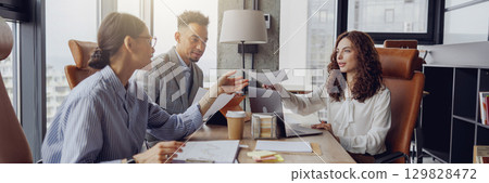 Engaging in a Collaborative Business Meeting within a Modern Office Environment Setup Engaging in a Collaborative Business Meeting within a Modern Office Environment Setup 129828472