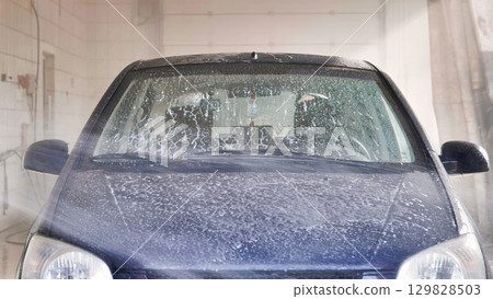 Car washing with soap and high pressure water jet 129828503