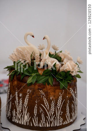 Exquisite Swan Wedding Cake with Rustic Bark Texture and Wheat Design. Ivory Floral Decor, Two Swans, Celebration. 129828550