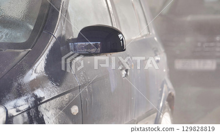 Car covered in soap during car wash Car covered in soap during car wash 129828819