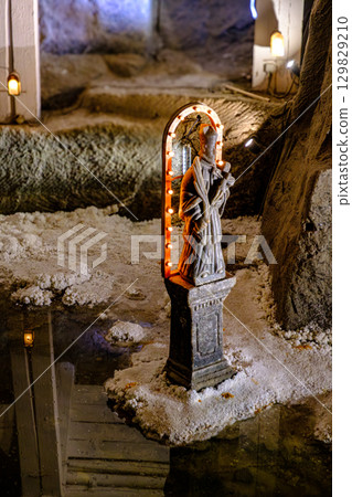 Salt statue of a saint in Wieliczka Salt statue of a saint in Wieliczka 129829210