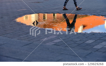 Puddle reflection in Warsaw's Old Town 129829268
