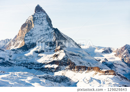 Snowy mountain Matterhorn during the day in winter. Zermatt, swiss alps Snowy mountain Matterhorn during the day in winter. Zermatt, swiss alps 129829843