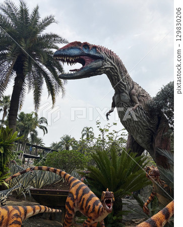 Pattaya, Thailand - Jul 31, 2025 : A large dinosaur in a 1:1 scale is displayed in the park of Nong Nooch garden, 129830206