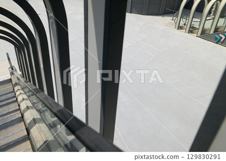 Modern Escalator and Architectural Arches in Boulevard, Riyadh. Modern Escalator and Architectural Arches in Boulevard, Riyadh. 129830291