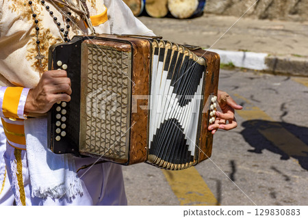 Accordionist with his instrument 129830883