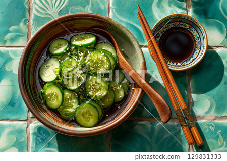 Refreshing cucumber salad with unique dressing and elegant chopsticks 129831333
