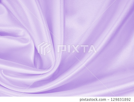 Smooth elegant lilac silk or satin texture as wedding background. Luxurious valentine day background design 129831892