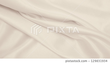 Smooth elegant golden silk or satin luxury cloth texture as wedding background. Luxurious background design. In Sepia toned. Retro style Smooth elegant golden silk or satin luxury cloth texture as wedding background. Luxurious background design. In Sepia toned. Retro style 129831934