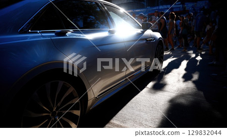 Modern Car Side Angle Lit by Sunlight with People in Background on Urban Streets Modern Car Side Angle Lit by Sunlight with People in Background on Urban Streets 129832044