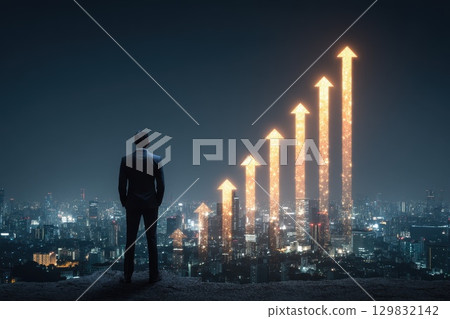 Businessperson Standing on Rooftop Overlooking City with Glowing Growth Graphs at Night 129832142