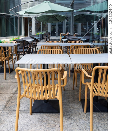 Outdoor dining table in the sun Outdoor dining table in the sun 129832440