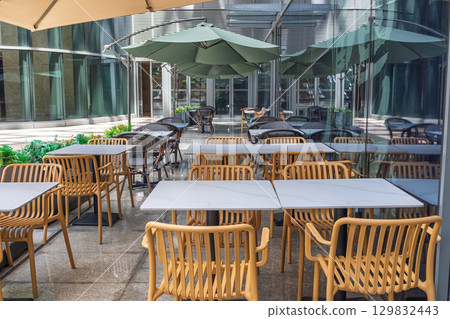 Outdoor dining table in the sun Outdoor dining table in the sun 129832443