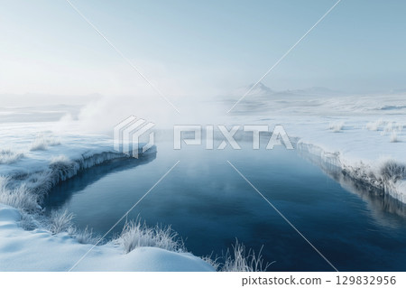 Relaxing in a geothermal hot spring surrounded by snowy mountains in Iceland 129832956