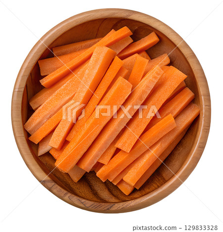 Fresh carrot sticks in rustic wooden bowl, healthy snack isolated on transparent background, healthy lifestyle and nutrition concept Fresh carrot sticks in rustic wooden bowl, healthy snack isolated on transparent background, healthy lifestyle and nutrition concept 129833328