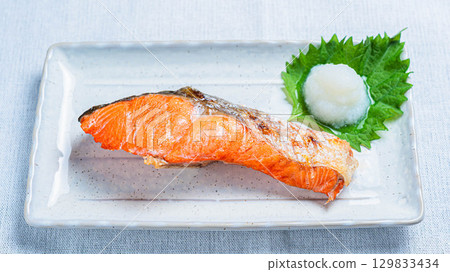 Grilled salted salmon with grated daikon radish, a classic Japanese dish Grilled salted salmon with grated daikon radish, a classic Japanese dish 129833434