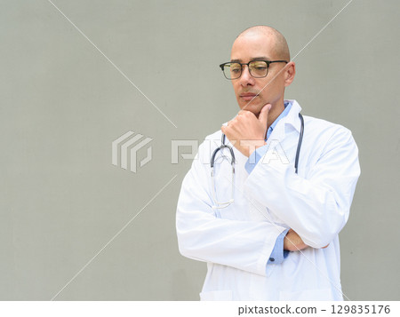 Hispanic Male Doctor in Lab Coat with Stethoscope on Plain Background Hispanic Male Doctor in Lab Coat with Stethoscope on Plain Background 129835176