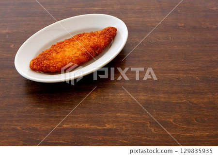 Fried white fish on the table background 129835935
