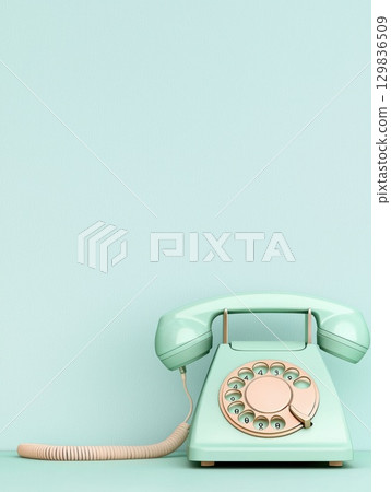 Mint green rotary telephone resting on pastel surface, embodying nostalgic communication design with vintage aesthetic and elegant mid century styling 129836509