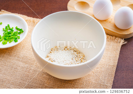 Making porridge with rolled oats Making porridge with rolled oats 129836752