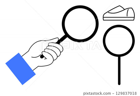 Hand holding magnifying glass inspecting shoe, accompanied by an additional magnifying glass. Ideal for online shopping, product inspection, search and discovery, quality control, investigation 129837018