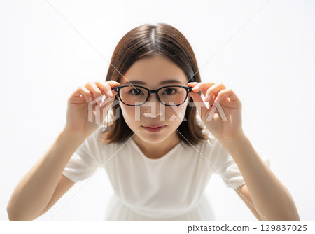 Facial expression and portrait of a woman wearing glasses 129837025