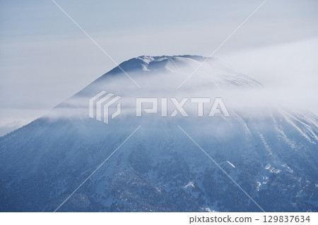View of Mt. Yotei from near the summit of Mt. Niseko Annupuri in the depths of winter View of Mt. Yotei from near the summit of Mt. Niseko Annupuri in the depths of winter 129837634