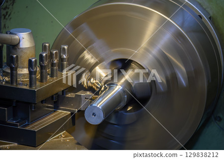 The lathe machine finish cut metal shaft parts. The lathe machine finish cut metal shaft parts. 129838212