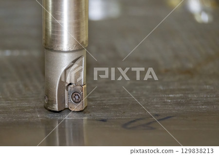 Close up scene the CNC milling machine rough cutting the mold parts by indexable tools. 129838213