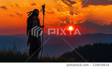 Silhouette of a Native American shaman with pikestaff on the backgroun. 129838616