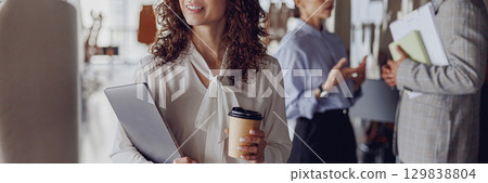 Engaging in Professional Networking Activities Within a Modern Office Environment Setting Engaging in Professional Networking Activities Within a Modern Office Environment Setting 129838804