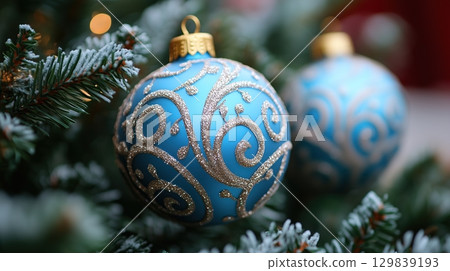 Christmas balls on a fir tree. Blue white. New Year holidays and celebration. 129839193