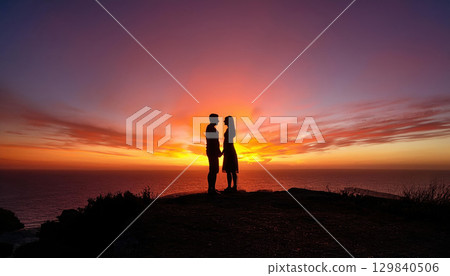 romantic silhouette of couple holding hands at sunset 129840506