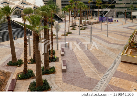 Elevated View of a Modern Public Plaza with Palm Trees in KAFD, Riyadh. Elevated View of a Modern Public Plaza with Palm Trees in KAFD, Riyadh. 129841106