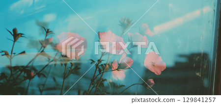 Floral elements blend with concrete textures, showcasing a harmony of nature and city life. 129841257