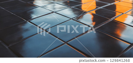 Black diamond tiles are arranged with contrasting grout, offering a striking graphic design look. Black diamond tiles are arranged with contrasting grout, offering a striking graphic design look. 129841268