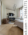 Modern Cozy Bedroom Interior with Fireplace 129841771