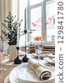 Close-Up of Elegant Table Setting Near Window 129841780