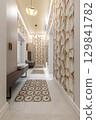 Stylish Hallway with Leaf Patterned Wallpaper and Benches 129841782