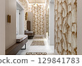 Stylish Hallway with Leaf Patterned Wallpaper and Benches 129841783