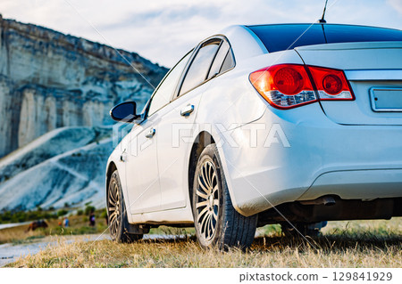 White car parked near White Rock mountain in Crimea 129841929