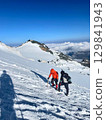 skiing on piste at winter season at beautiful sunny day skiing on piste at winter season at beautiful sunny day 129841943