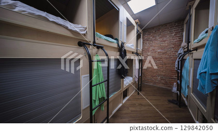 Capsule hotel offering comfortable and affordable sleeping pods 129842050