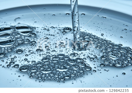 Bubbles in the beautiful texture of hyaluronic serum. 129842235