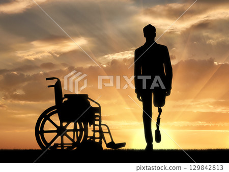 Walking is a disabled man with a prosthetic leg 129842813