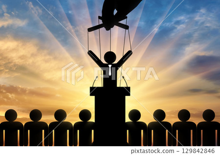 Politician is a puppet and a hand is pulling him by strings 129842846